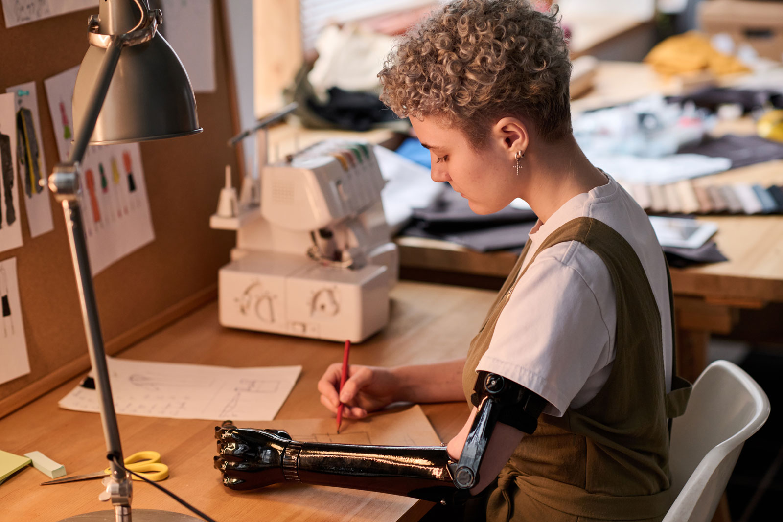 woman with prosthetic arm working on marketing plan