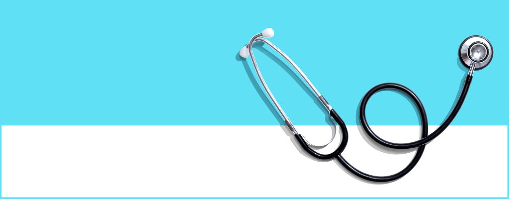 stethoscope against a light blue and white background