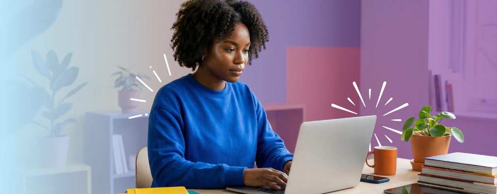 A woman working at her desk with a laptop, representing the use of microanimations for enhancing email marketing strategies